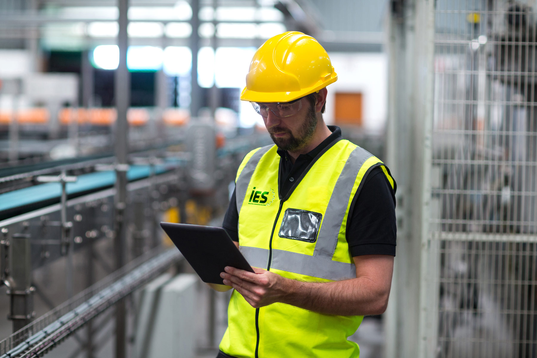 IES engineer reviewing warehouse safety system installation plans