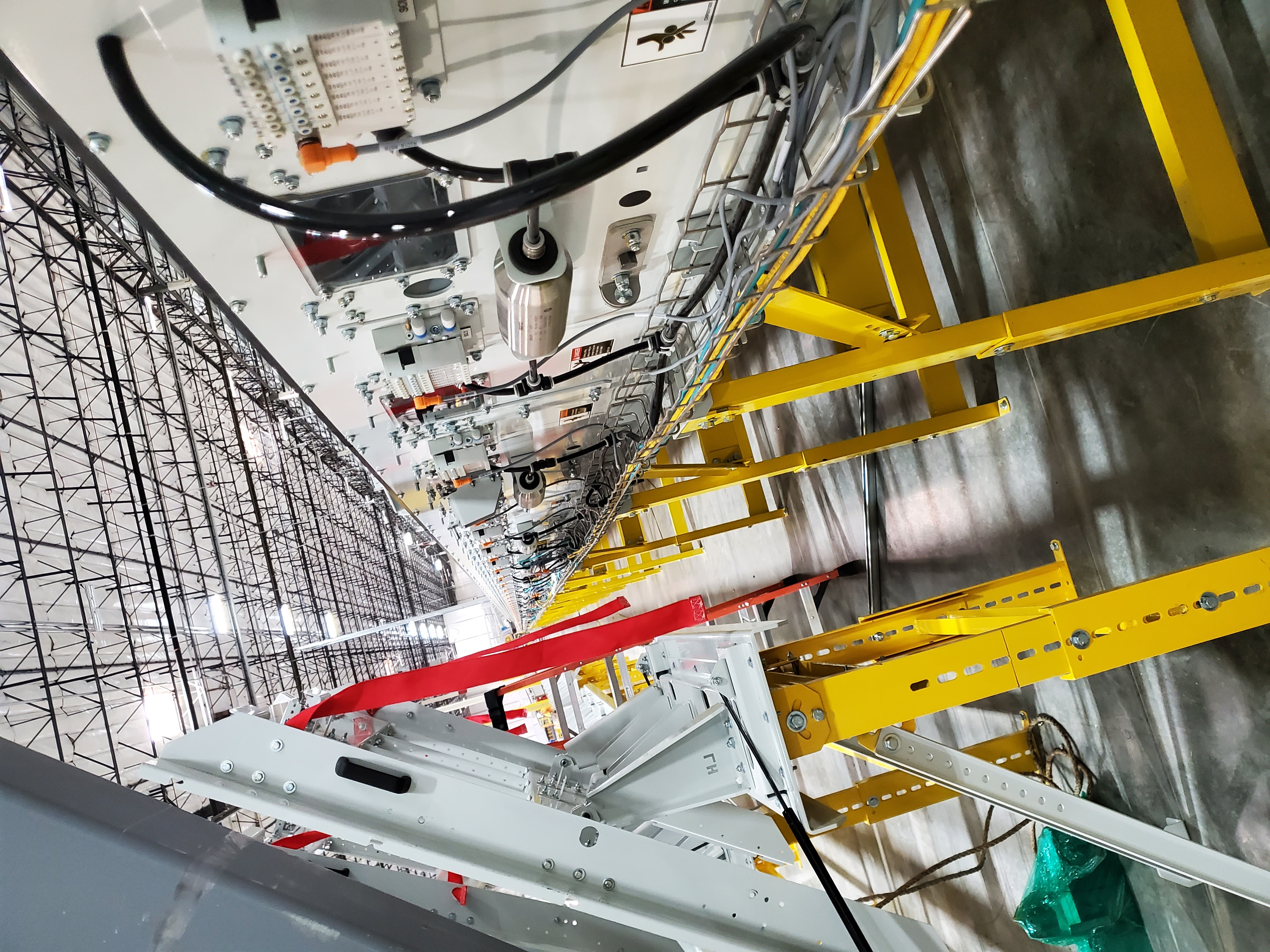 IES technician installing forklift safety sensor and control panel at industrial facility