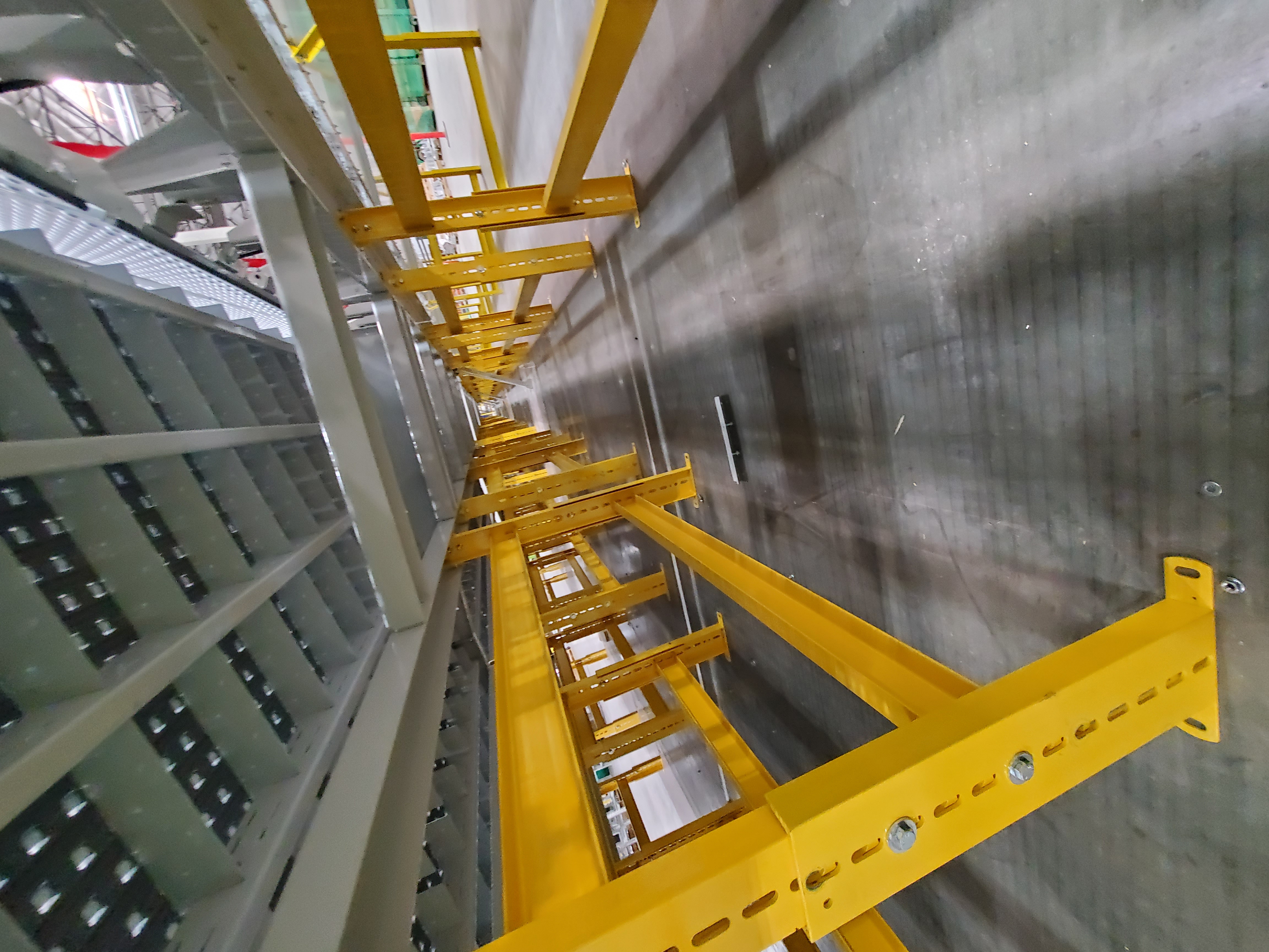 IES engineer performing scheduled maintenance and calibration on warehouse safety system